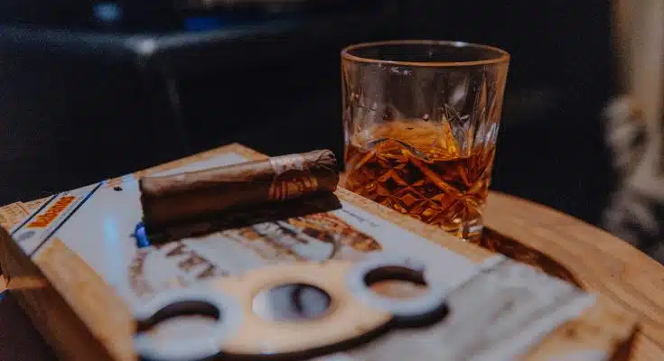 clear drinking glass on brown wooden table