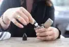 person holding silver flip lighter