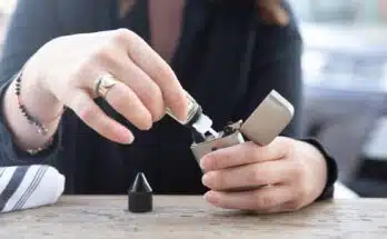 person holding silver flip lighter